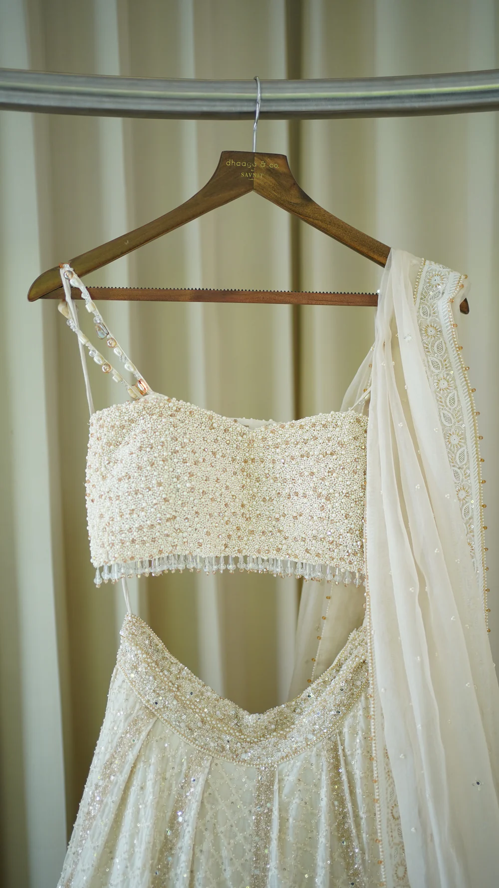 Ivory Chanderi Lehenga paired with embellished blouse