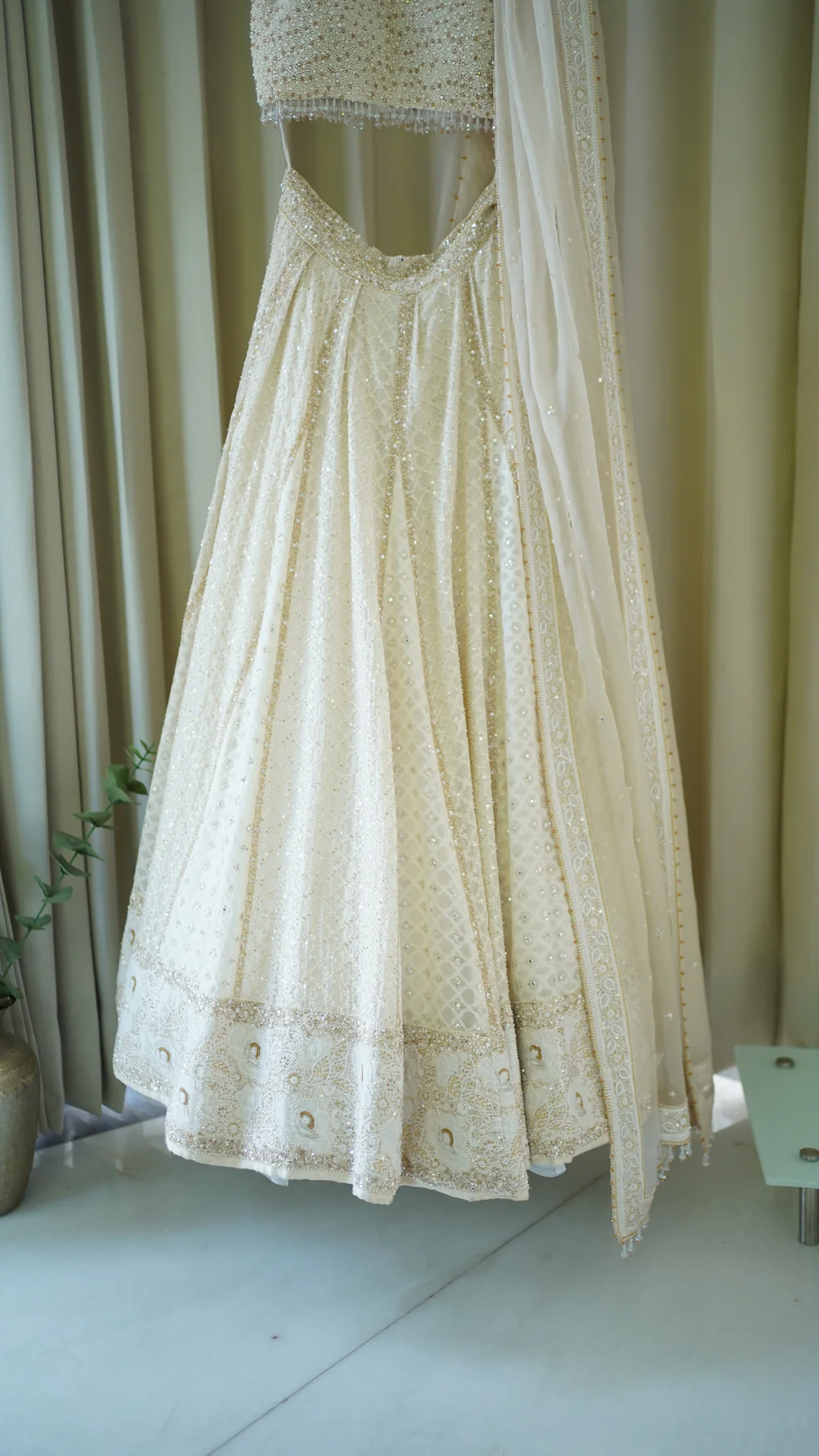 Ivory Chanderi Lehenga paired with embellished blouse